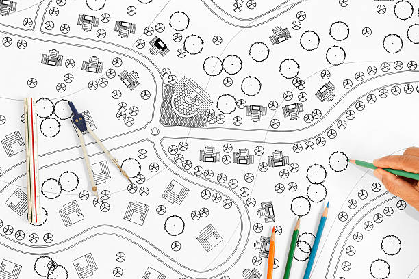 istock Landscape Architect Designs Blueprints For Resort. 577958898