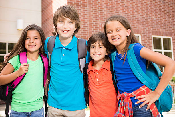 istock Back to School:  Elementary-age children, friends on school campus. 577960008