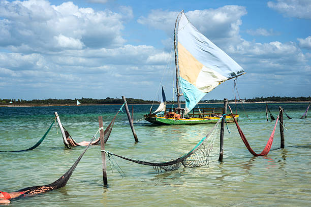 Sail boat and hammocks, Jericoacoara, Brazil Sail boat and hammocks at the Paradise Lake (Jericoacoara, Brazil) ceará state brazil stock pictures, royalty-free photos & images