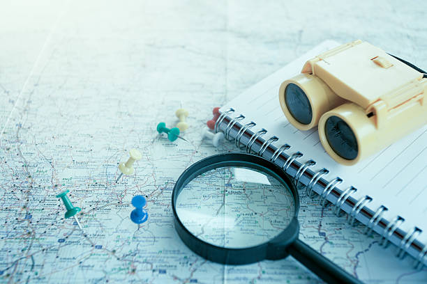 istock Travel concept with Magnifying glass, pushpins on map 577963354