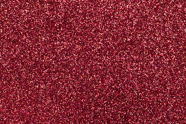 istock Sparkling background of red sparkles closeup. 577964196