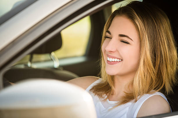 istock Young woman driving car 577965734
