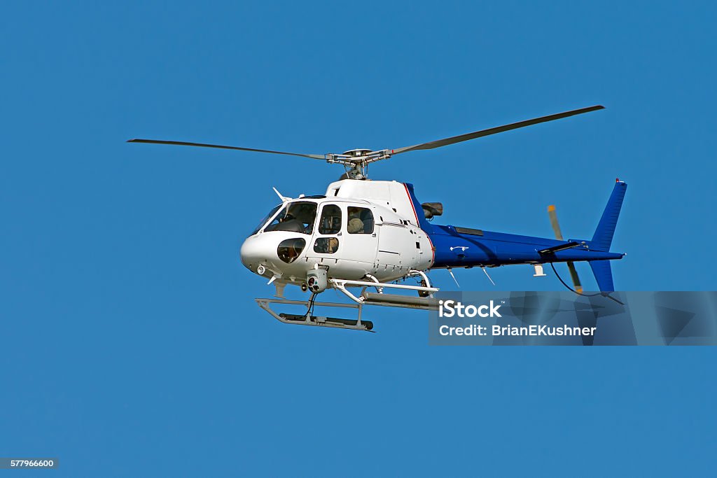 Helicopter Against Blue Sky Helicopter Stock Photo