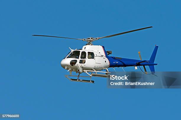 Helicopter Against Blue Sky Stock Photo - Download Image Now - Helicopter, Aerial View, Backgrounds