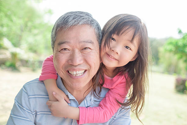 istock grandfather carrying cute granddaughter selfi 577966672