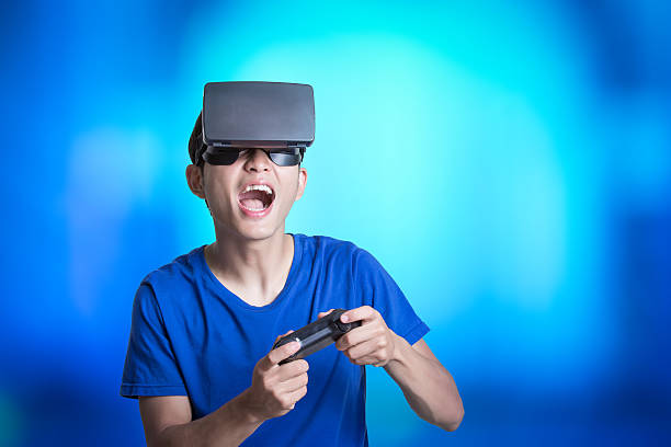 man wear virtual reality headset - young male fotos imagens e fotografias de stock