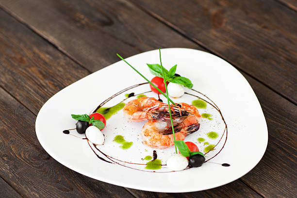 istock White plate with fried shrimps on wood, copyspace 577968138