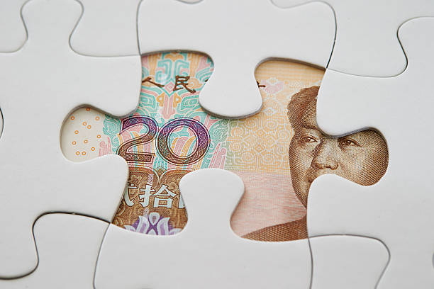 istock Chinese RMB bill with jigsaw puzzle 577969410