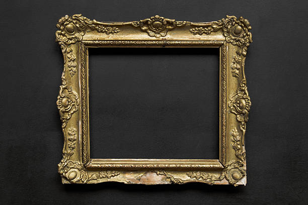 istock Old ornate vintage golden frame on black background 577971930
