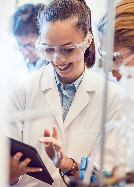 istock Two Young Female Scientists Looking at the PC tablet 577974856