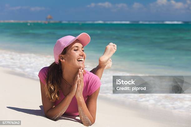 Portrait Of A Woman Smiling On The Sand Stock Photo - Download Image Now - 30-34 Years, 35-39 Years, Adult