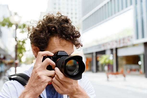 istock Male photographer taking picture 577978182