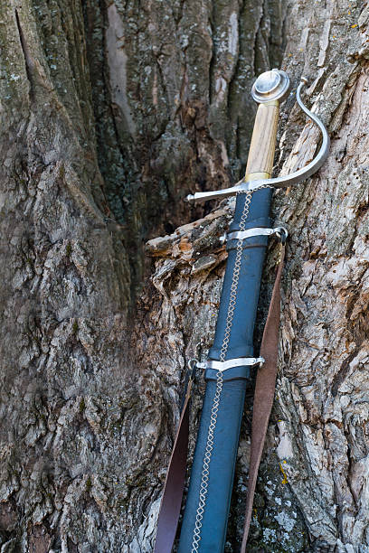 istock sword vintage on wooden background 577978238