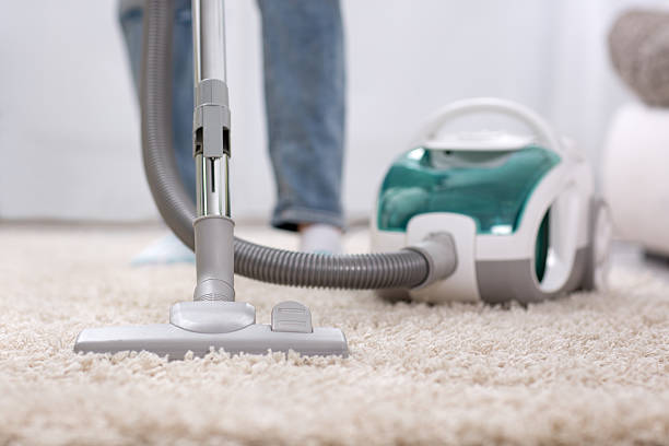 istock Cleaning carpet with vaccum cleaner 577978688