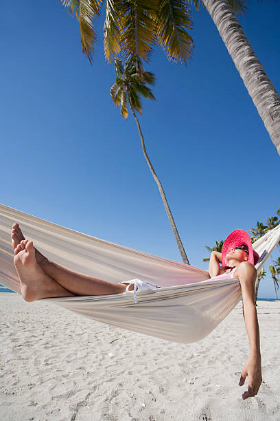 istock woman in a hammock by the sea 577979394
