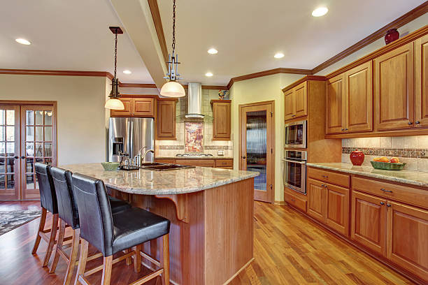 istock Kitchen interior with island. Wooden cabinets with granite counter top 577979506