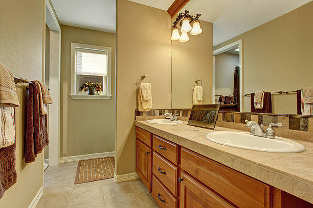 istock Bathroom interior with wooden cabinets and big mirror 577980180