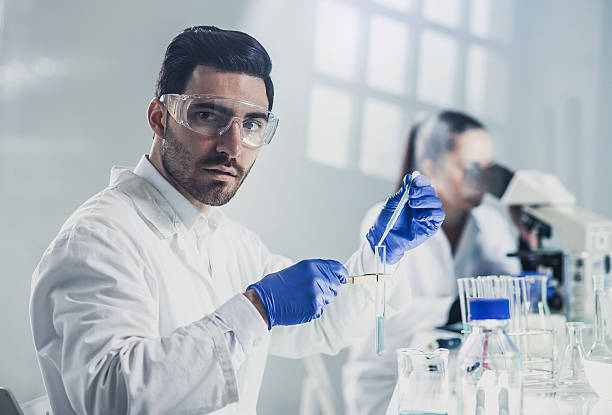 istock Portrait of a Scientist Using Lab Glassware 578075238