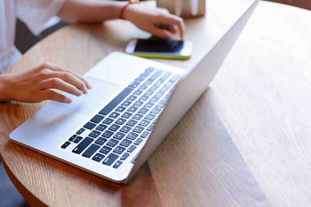 istock Businesswoman using laptop in cafe. 578076188