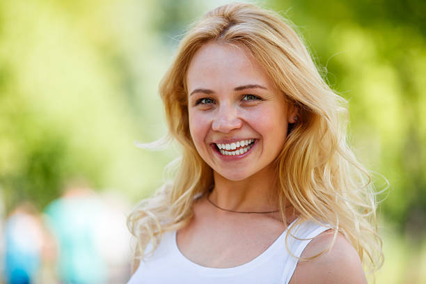 istock Beautiful young woman on nature summer bakground 578076744