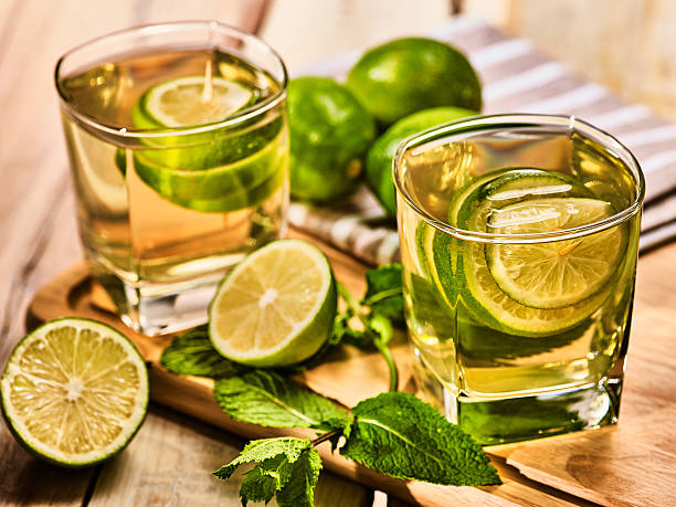 istock On wooden boards are glasses with green transparent drink. 578077110