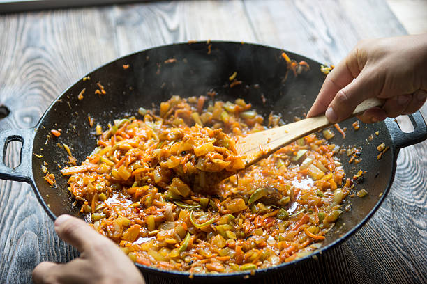 Cooking chongqing vegetables in wok at home, traditional szechuan (sichuan) chinese meal