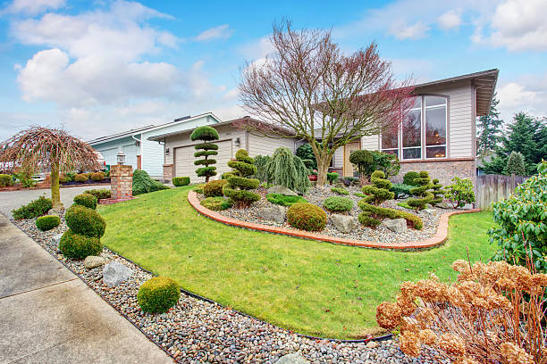 istock House exterior with well kept lawn and nice landscaping desing 578080038