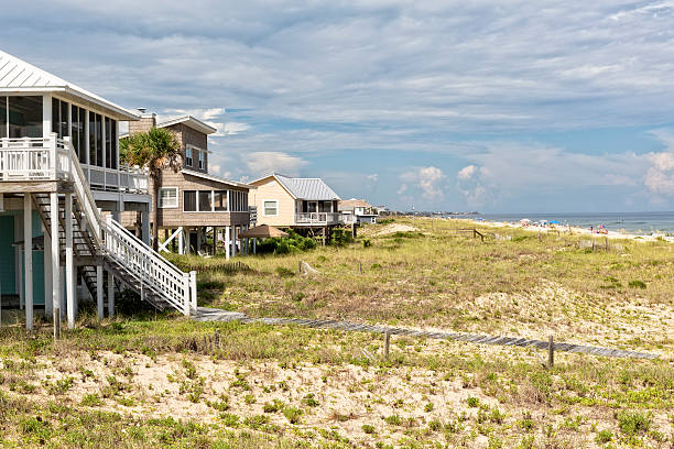 Beach Houses on St. George Island in Florida Florida beach houses that overlook the Gulf of Mexico on St. George Island. stilt house stock pictures, royalty-free photos & images