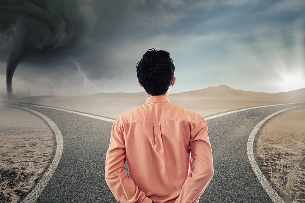 istock Businessperson looking at two different road 578081950
