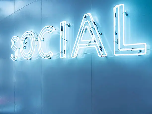 Photo of Social Media Type font Neon sign light Signage on wall