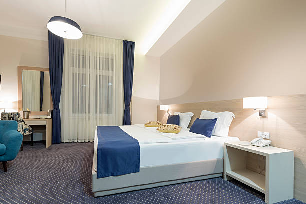 istock Hotel bedroom interior in the evening 578084830