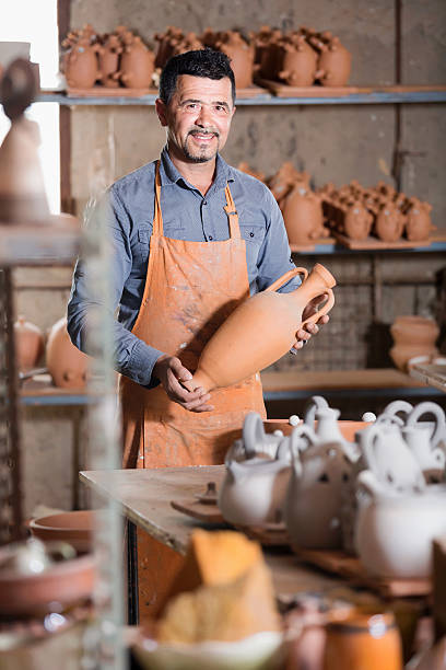 istock Happy male artisan having ceramics 578085452