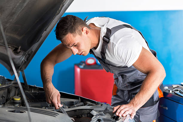 istock Mechanic repairs car 578085596