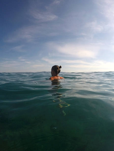 istock Young woman bathing in Adriatic sea 578086322