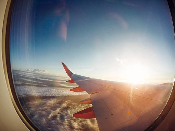 istock Watching the Sun Rise at 30,000ft 578087028