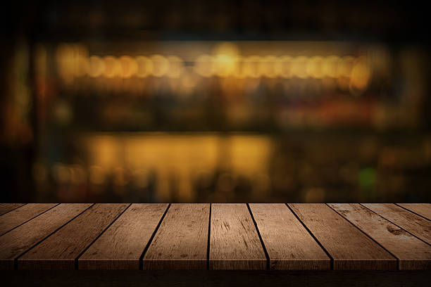 istock wooden table with a view of blurred beverages bar backdrop 578088582