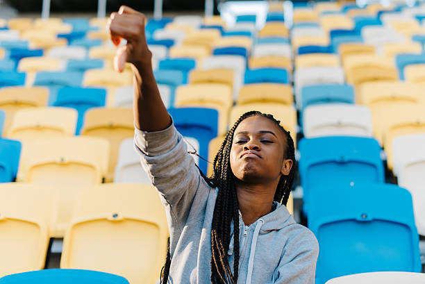 istock Afro-American young woman doing a thumbs down signal with 578088600