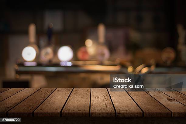 Wooden Table With A View Of Blurred Beverages Bar Backdrop Stock Photo - Download Image Now