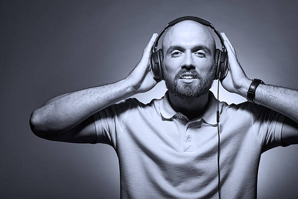 istock Happy smiling young man with earphones 578088732