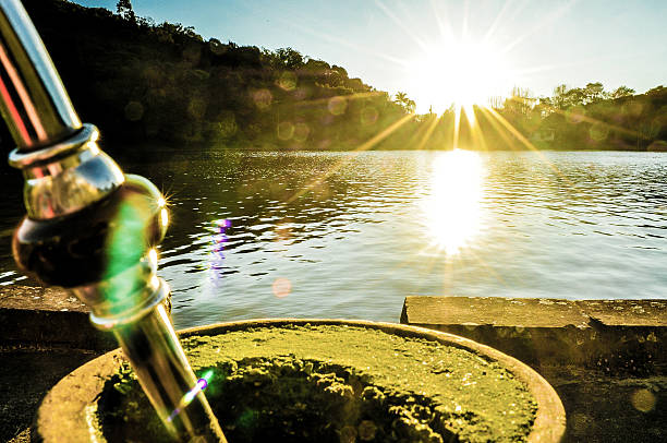 Mate the pond with sun Sun, lagoon and chimarrão in the taquari valley.  gaucho stock pictures, royalty-free photos & images