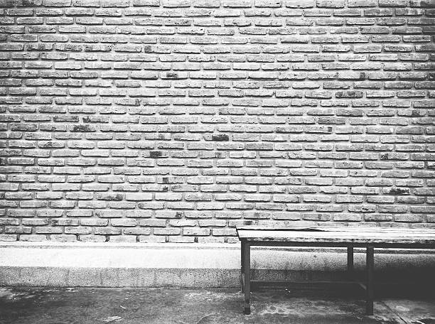 istock Wall brick textured background with old chesterfield. 578091502