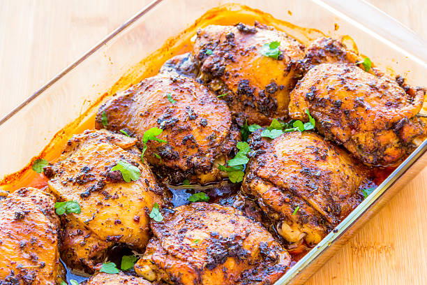 chicken thigh roasted - chicken thighs imagens e fotografias de stock