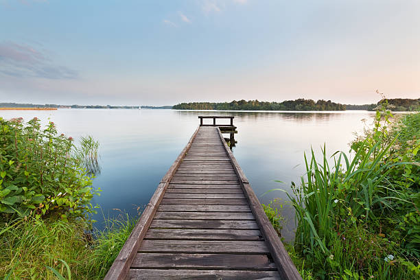 istock long pier on lake and blue sky 578091754