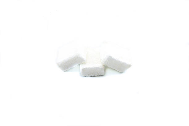 istock Cubes of sugar on white background 578093014