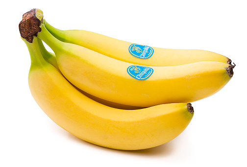 Ankara, Turkey - June 16, 2016: Chiquita is leading American producer and distributor of bananas and other produce. Studio shot of bunch of Chiquita bananas on white background. 