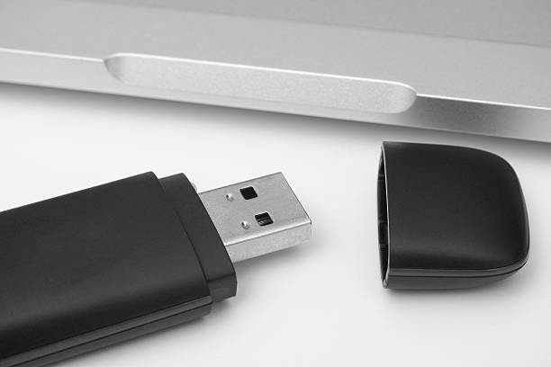istock USB Flash Drive with laptop in the background 578094700