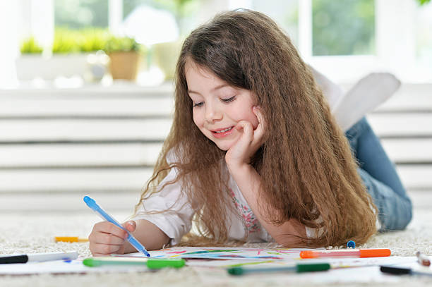 istock Little girl drawing at  class 578094852