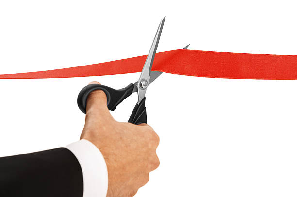 Cutting Red Ribbon Red ribbon cutting with a pair of scissors for the inauguration of the new business activity inauguration into office photos stock pictures, royalty-free photos & images
