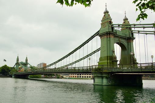 Hammersmith bridge over Thames river in London, England.