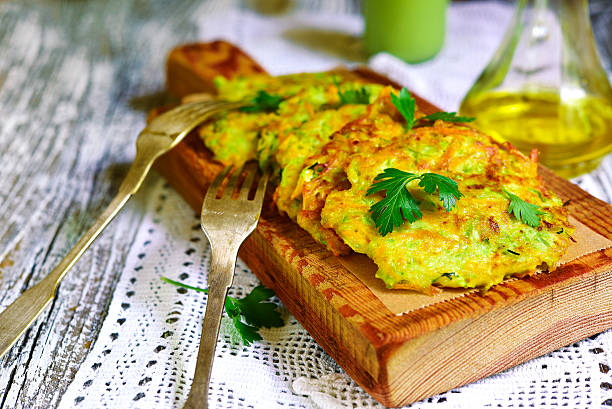 istock Zucchini fritters with garlic and carrot. 578097836